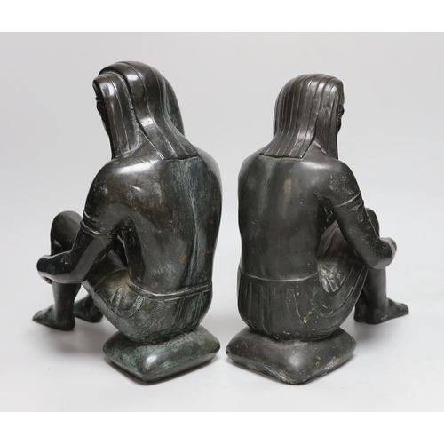 374 - A pair of cast bronze seated Egyptian figures wearing headdresses, the largest 30cm high