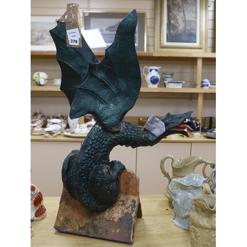 376 - A Chinese green painted terracotta ridge tile in the form of a dragon, 80cm high (af)