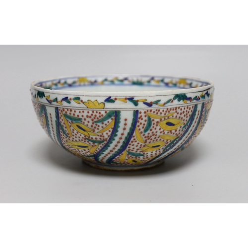 388 - A Turkish Kutahya bowl hand painted with stylised flowers, 19cm in diameter