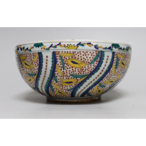 388 - A Turkish Kutahya bowl hand painted with stylised flowers, 19cm in diameter