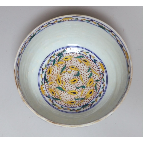 388 - A Turkish Kutahya bowl hand painted with stylised flowers, 19cm in diameter