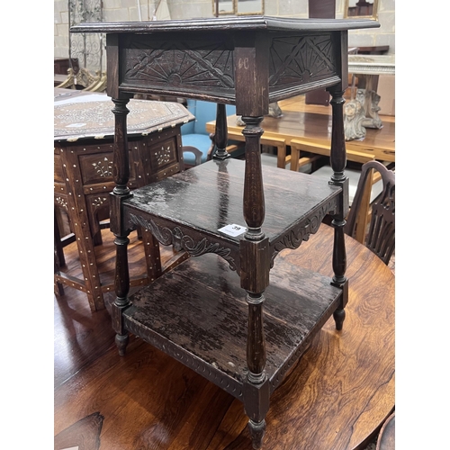 39 - An early 20th century oak three tier occasional table, width 41cm, height 75cm