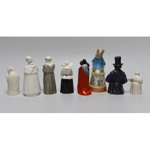 392 - A collection of eight extinguishers including Worcester and Royal Doulton, the largest 13cm high... 