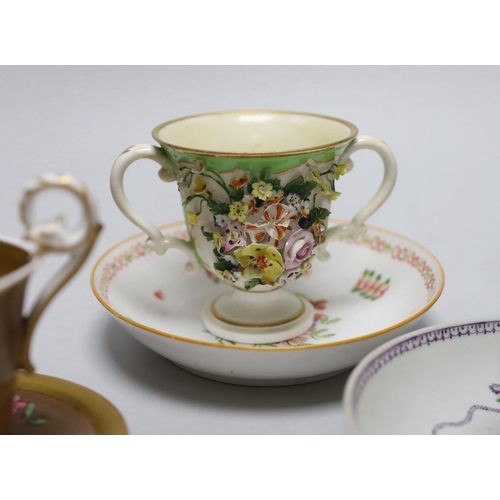 393 - A group of early 19th century English porcelain cups and various saucers to include a Spode two hand... 