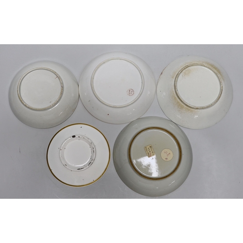 393 - A group of early 19th century English porcelain cups and various saucers to include a Spode two hand... 