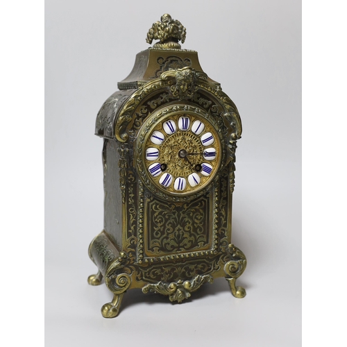 394 - A late 19th century French brass Boulle work mantel clock, with key and pendulum, 30cm high