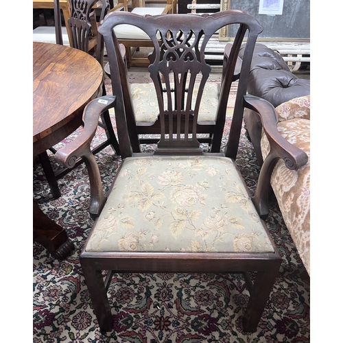 41 - A set of six George III style mahogany dining chairs including two carvers