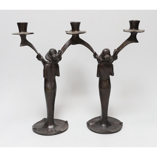 418 - After Jules Moigniez (1835-1984) - a pair of bronze two branch candelabra, signed, dated 1902, 34cm ... 