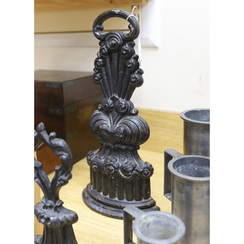 424 - A graduated set of seven French pewter measures, a toleware spice box and two cast iron door stops (... 