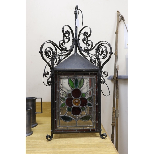 425 - A late 19th/early 20th century Arts and Crafts style wrought iron and stained glass panelled hanging... 