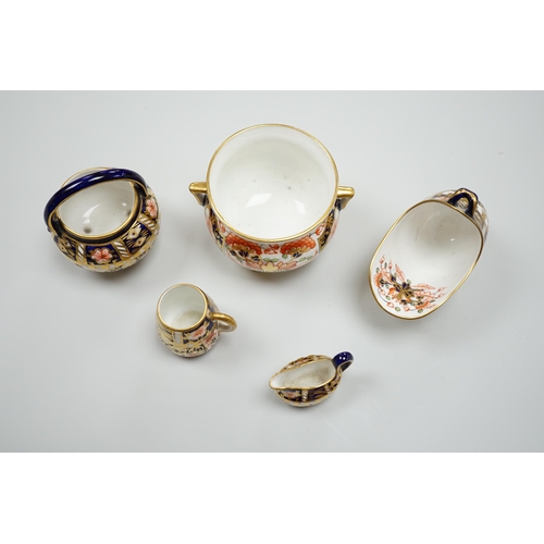 428 - 20th century Derby miniature wares in Imari patterns including a mug, a sauceboat, a cauldron, a lar... 