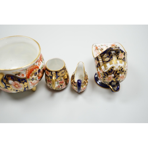 428 - 20th century Derby miniature wares in Imari patterns including a mug, a sauceboat, a cauldron, a lar... 