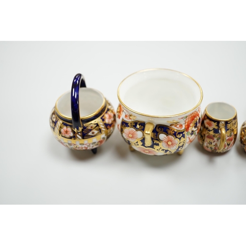 428 - 20th century Derby miniature wares in Imari patterns including a mug, a sauceboat, a cauldron, a lar... 