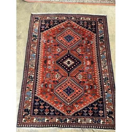 43 - A Caucasian red ground rug, 144 x 105cm