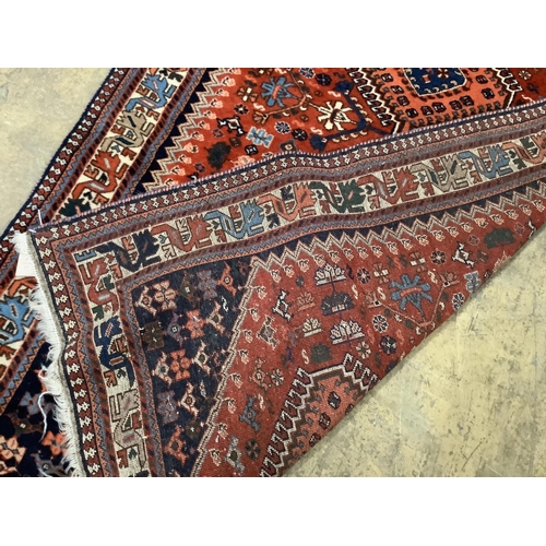 43 - A Caucasian red ground rug, 144 x 105cm