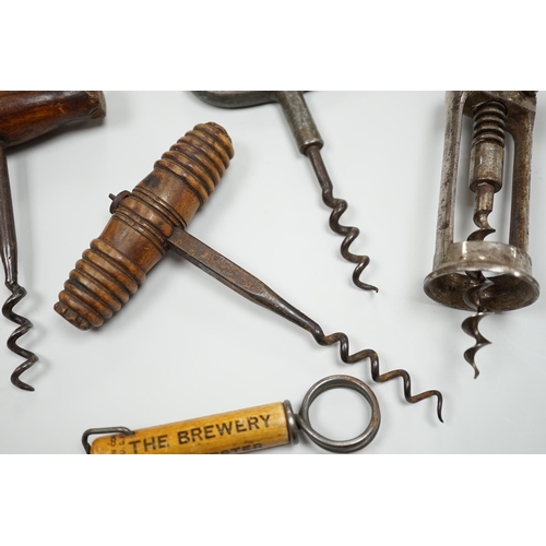 436 - A 19th century iron corkscrew, with a turned wood handle and four other corkscrews (5)