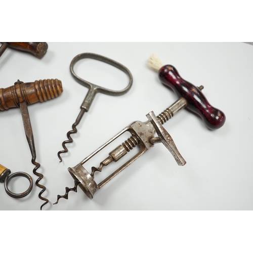 436 - A 19th century iron corkscrew, with a turned wood handle and four other corkscrews (5)