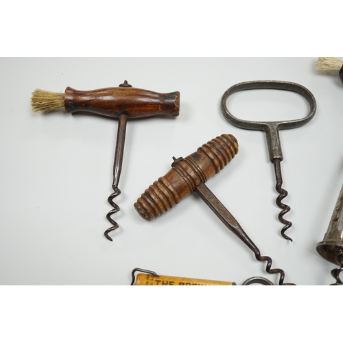 436 - A 19th century iron corkscrew, with a turned wood handle and four other corkscrews (5)