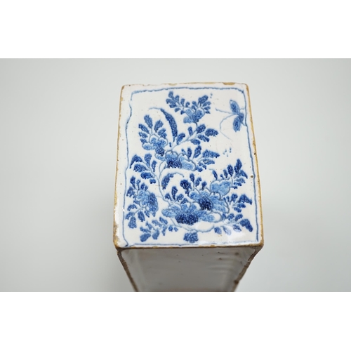 437 - A mid 18th century English delftware flower brick, probably Lambeth, painted in underglaze blue with... 