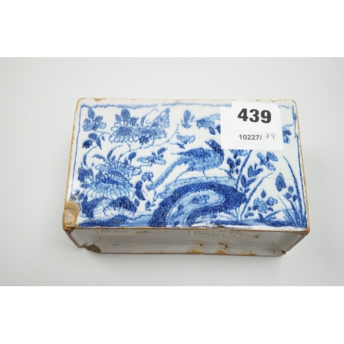 439 - A mid 18th century English delftware flower brick, probably Lambeth, painted in underglaze blue with... 