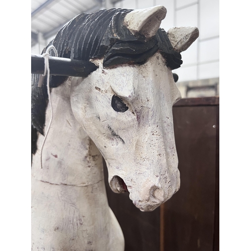 44 - A Victorian style painted hardwood rocking horse, height 80cm