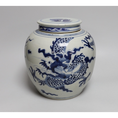 472 - An 18th/19th century Chinese blue and white dragon jar, with associated cover, jar 20.5cm high... 