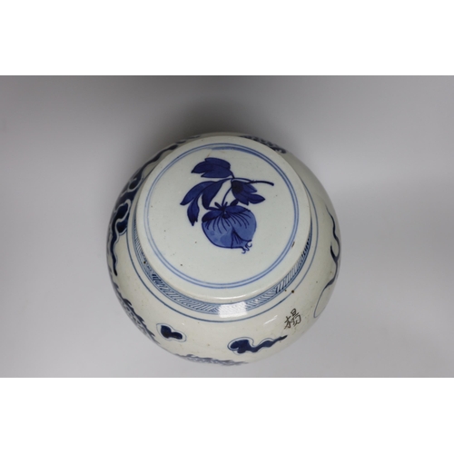 472 - An 18th/19th century Chinese blue and white dragon jar, with associated cover, jar 20.5cm high... 