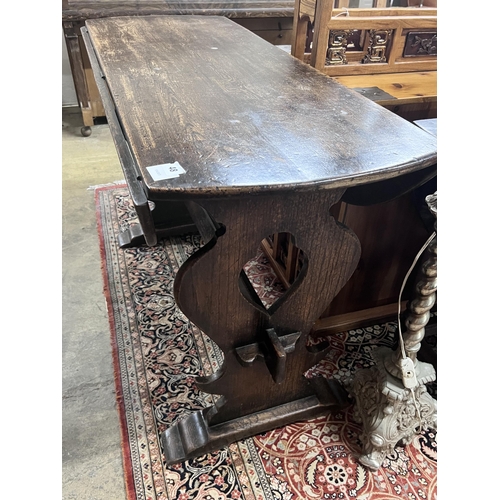 48 - An 18th century style Spanish design oak drop leaf dining table, length 122cm, depth 45cm, height 76... 