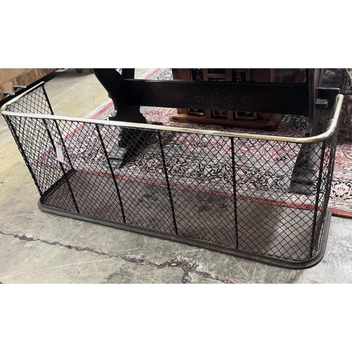 49 - A Victorian brass mounted cast iron and mesh fender, width 122cm, depth 30cm, height 46cm