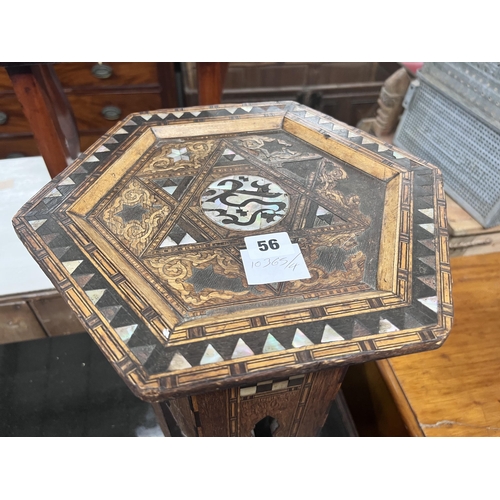 56 - A Moorish mother of pearl inlaid hexagonal occasional table, width 32cm, height 46cm