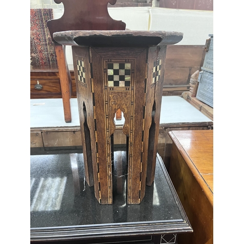 56 - A Moorish mother of pearl inlaid hexagonal occasional table, width 32cm, height 46cm