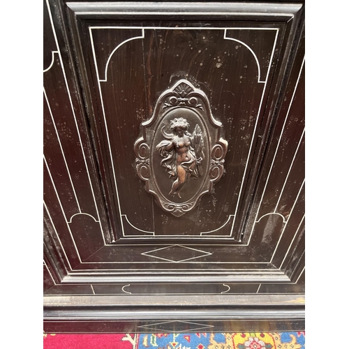 57 - A French ebonised marble top pier cabinet, width 79cm, depth 43cm, height 99cm