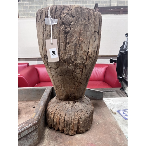 60 - A carved hardwood mortar, height 49cm