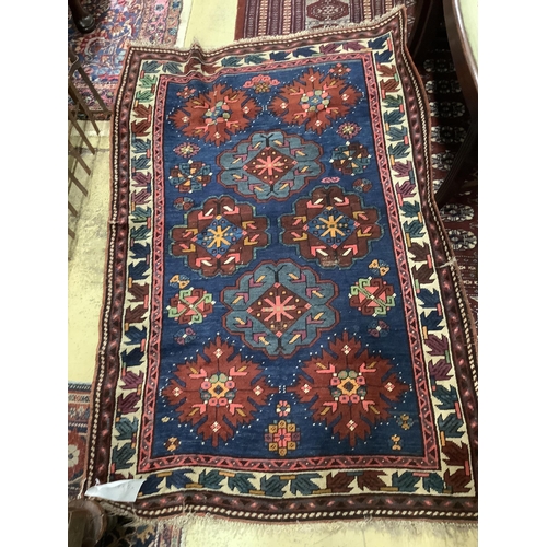 62 - A Caucasian Seychour blue ground rug, 144 x 98cm