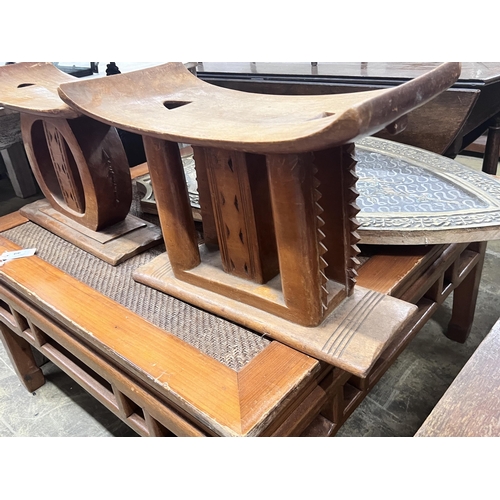 65 - Two African hardwood stools, width 25cm, height 37cm