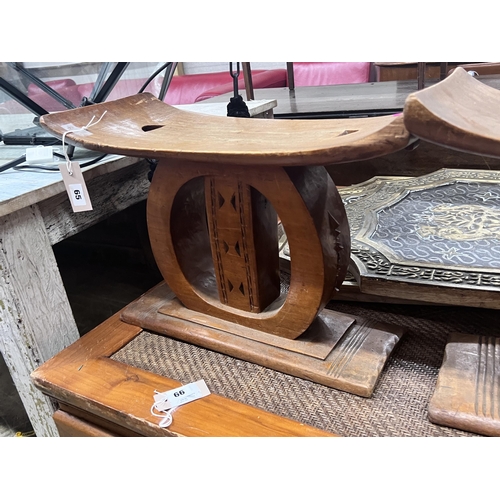 65 - Two African hardwood stools, width 25cm, height 37cm