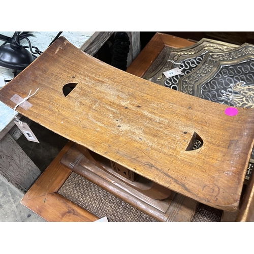 65 - Two African hardwood stools, width 25cm, height 37cm