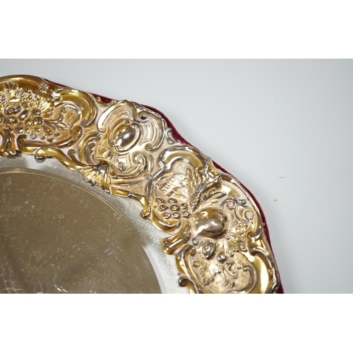 809 - An Edwardian silver mounted circular easel mirror, Walker & Hall, 26.5cm, an Art Nouveau silver trin... 