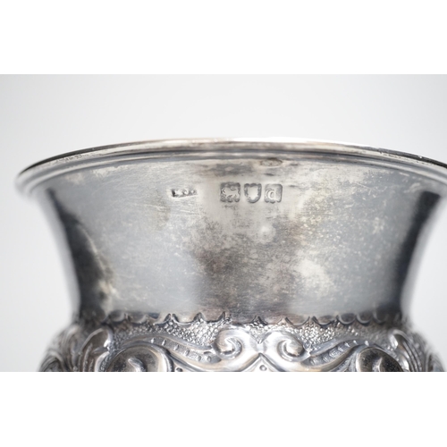 810 - A late Victorian embossed silver bulbous pedestal vase, Matthew John Jessop, London, 1899, height 10... 