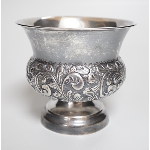 810 - A late Victorian embossed silver bulbous pedestal vase, Matthew John Jessop, London, 1899, height 10... 