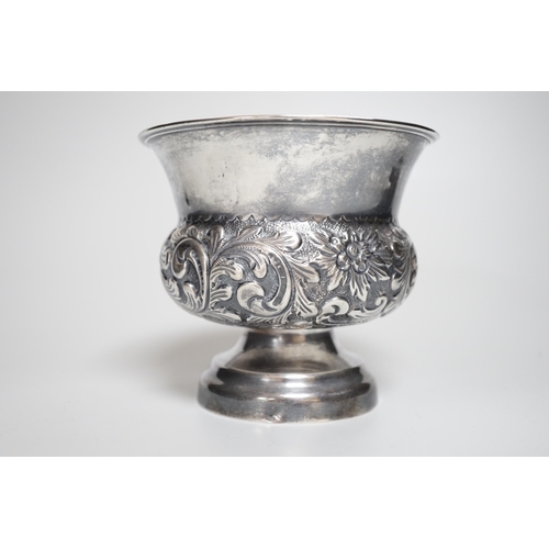 810 - A late Victorian embossed silver bulbous pedestal vase, Matthew John Jessop, London, 1899, height 10... 