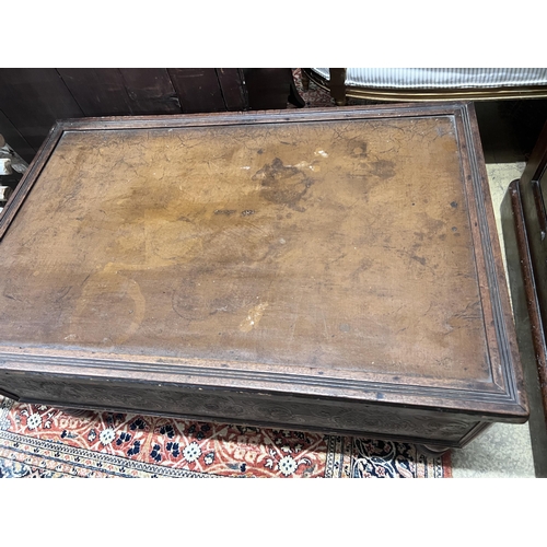 87 - A rectangular embossed leather covered mahogany coffee table on turned feet, incorporates old timber... 