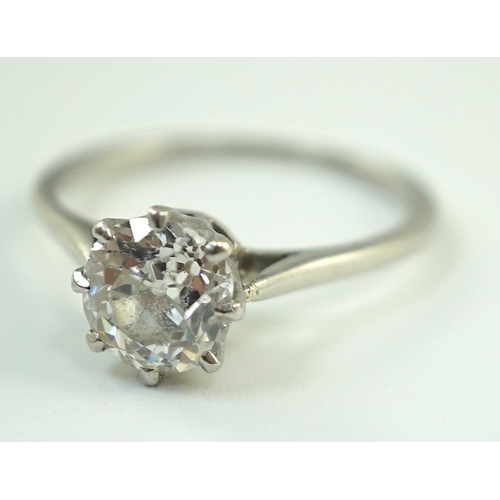 885 - A platinum and solitaire diamond set ring, the round cut stone weighing approximately 1.30ct, size L... 