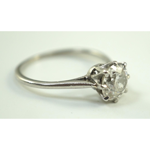 885 - A platinum and solitaire diamond set ring, the round cut stone weighing approximately 1.30ct, size L... 