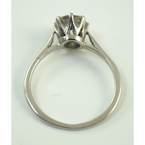 885 - A platinum and solitaire diamond set ring, the round cut stone weighing approximately 1.30ct, size L... 