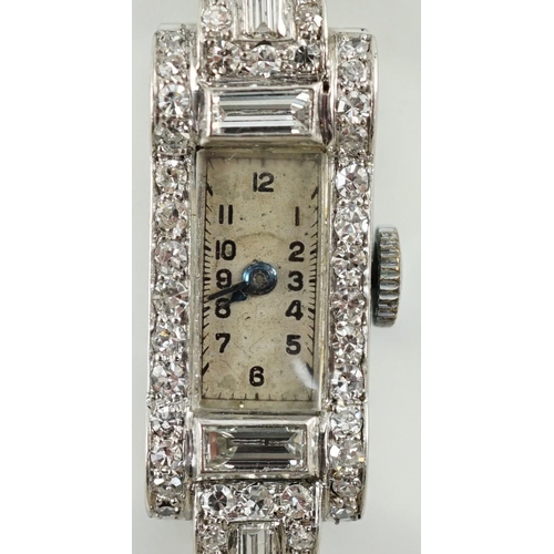 891 - A lady's 1930's/1940's platinum, baguette and round cut diamond set rectangular dial manual wind coc... 