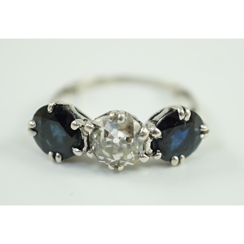 897 - A white gold, sapphire and diamond set three stone ring, central stone approximately 1.4ct the diamo... 