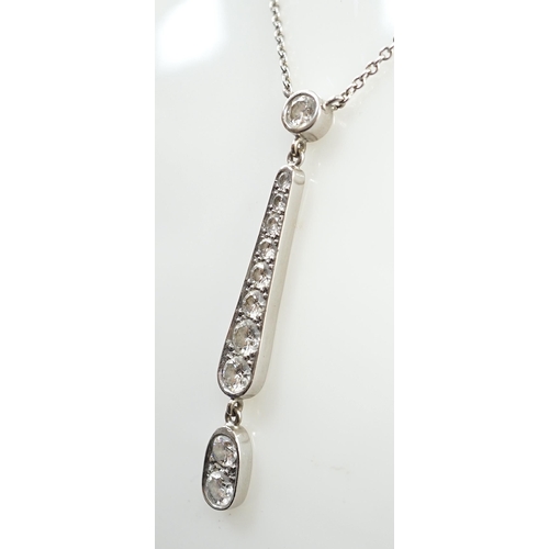 899 - A modern 18ct white gold and graduated eleven stone diamond set drop pendant necklace, 51cm, gross w... 