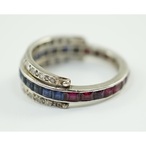 900 - A mid 20th century white gold, diamond, ruby and sapphire set swivelling triple band eternity ring, ... 