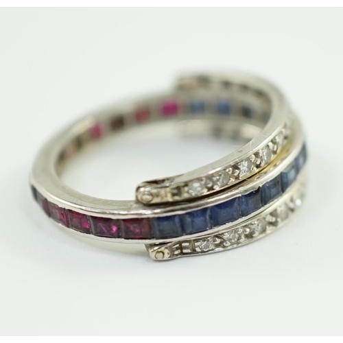 900 - A mid 20th century white gold, diamond, ruby and sapphire set swivelling triple band eternity ring, ... 